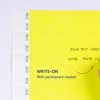 Bilden visar en ljusgul sida med instruktioner att skriva på den med en permanent marker. Det finns utrymmen för text, inklusive 'Your text here' på engelska och 'Votre texte ici' på franska.