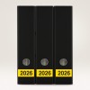 The image shows three black binders arranged side by side, each labeled with the year '2026' on a yellow strip.